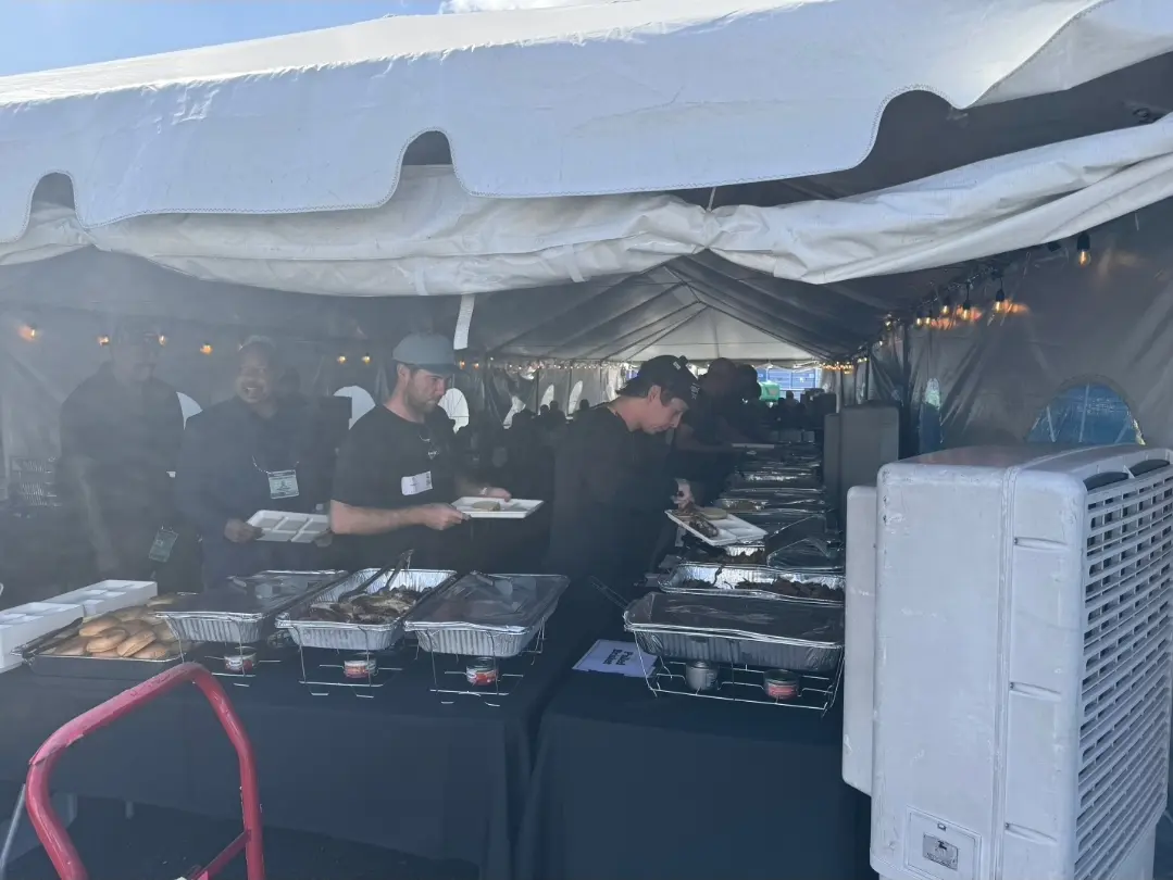 Production crew enjoying Jimmy Bear's BBQ catering in the dining tent