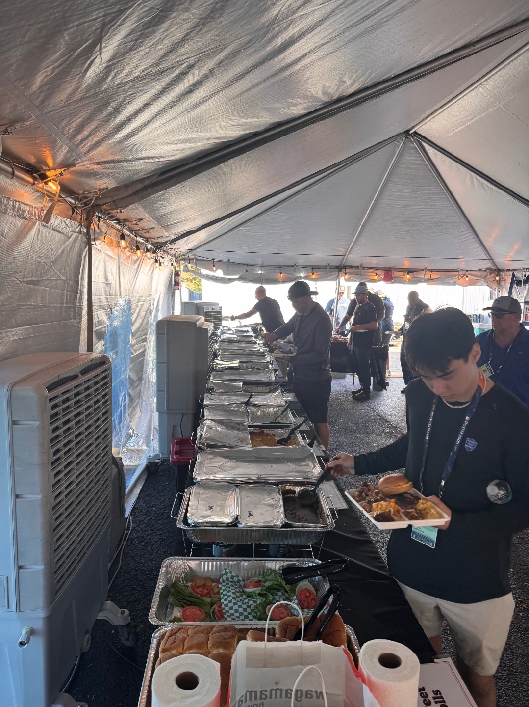 World Series production staff filling their plates from the Jimmy Bear's BBQ buffet